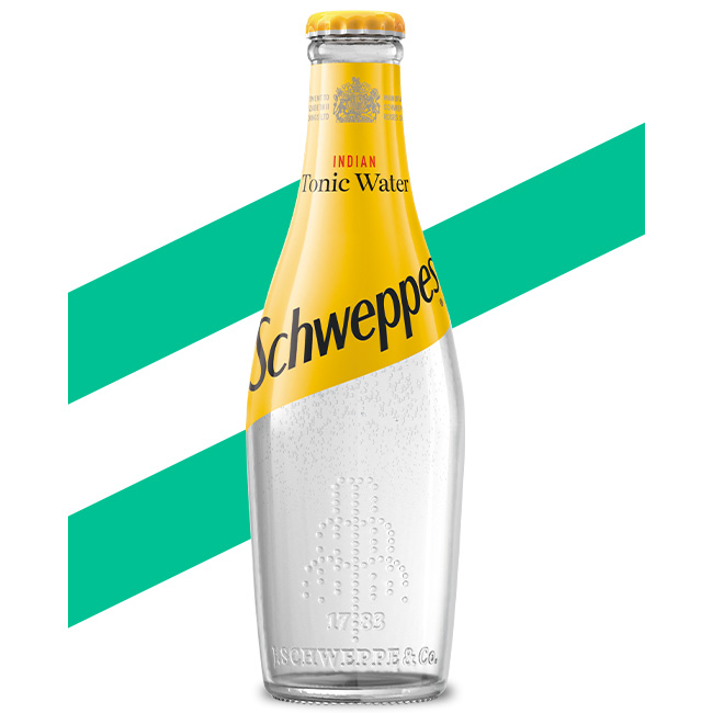 Schweppes Indian Tonic Water bottle on white background.