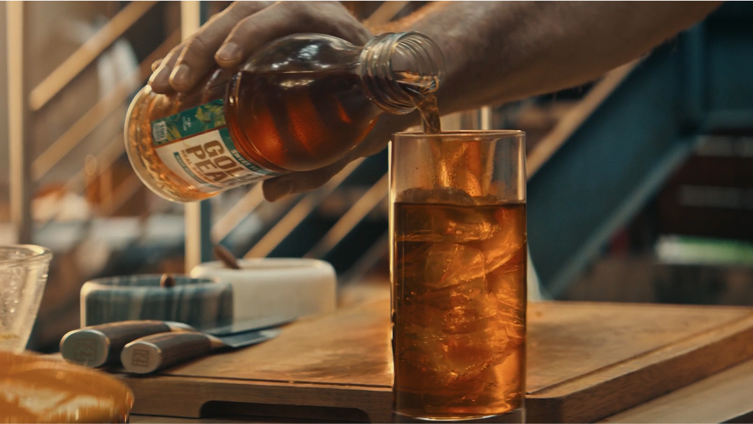 glass of iced tea being poured