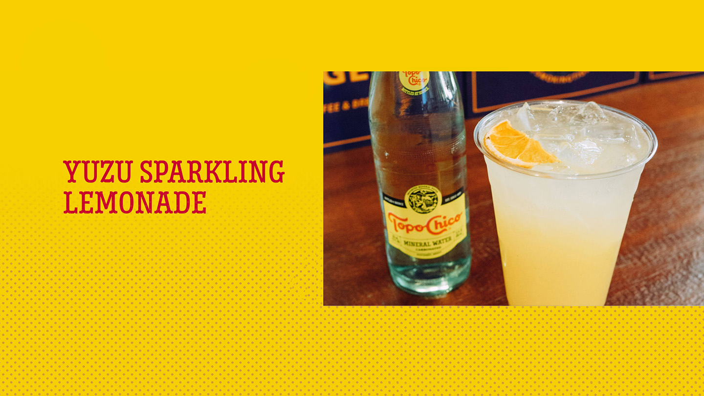 A bottle of Topo Chico next to a glass of Yuzu Sparkling Lemonade